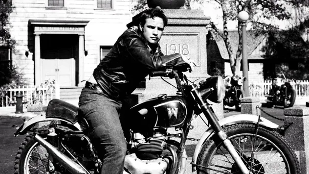 Marlon Brando in the jacket looking cool sitting on a motorcycle