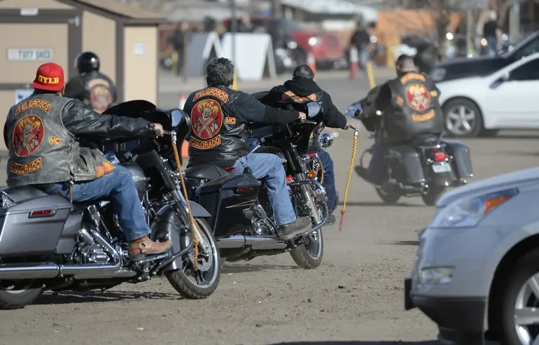 People ride motorcycles at the National Western Complex