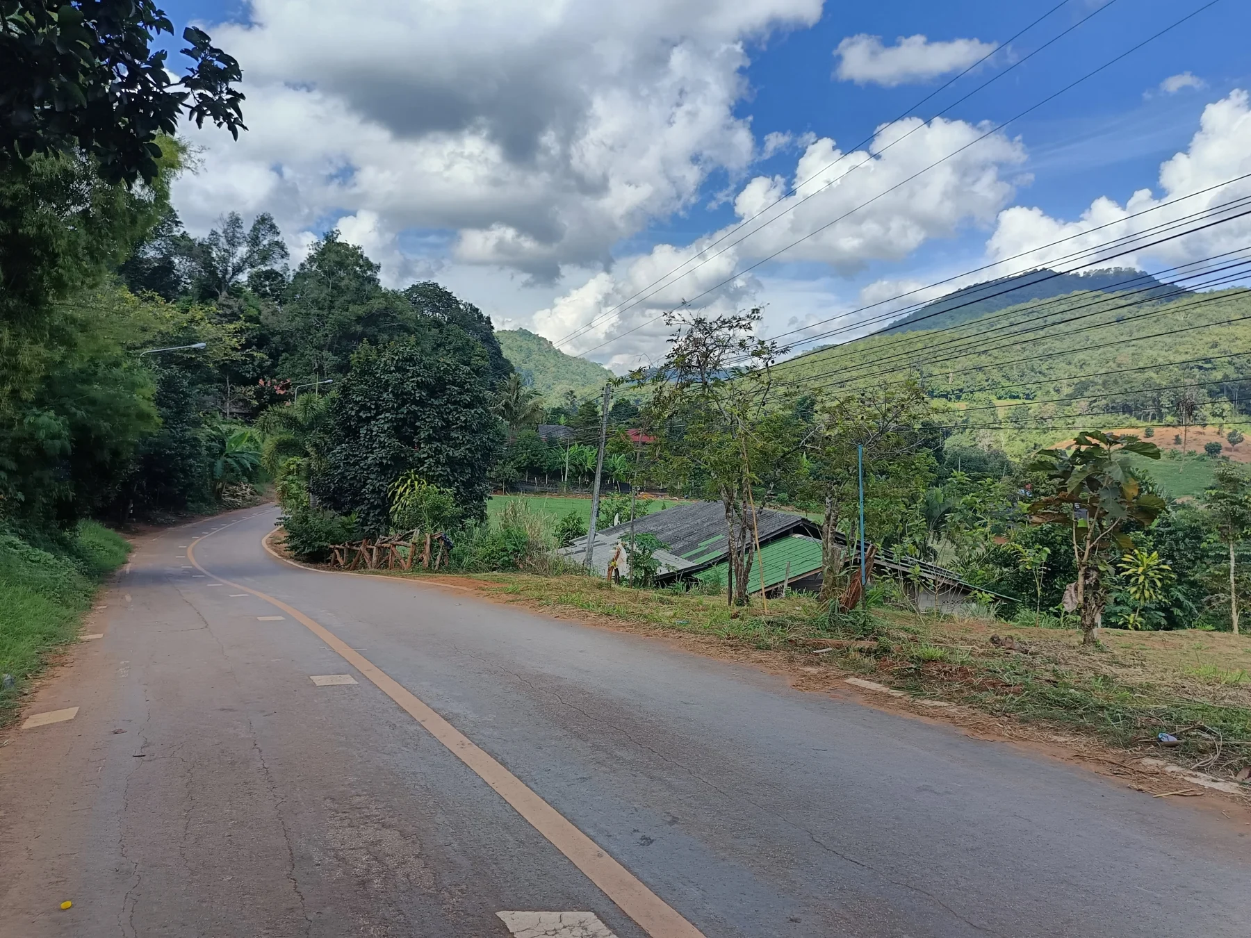 The Ban Mae Sap village gate and then a little bit up again through a lovely narrow valley to Tung Ting
